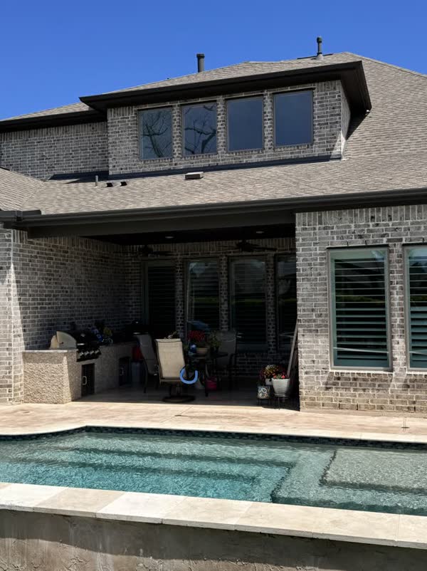 2-story brick home with pool in Houston, by Rinse & Shine
