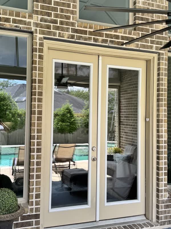French doors, poolside view in Houston, by Rinse & Shine