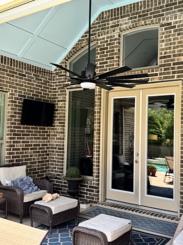 Covered patio with French doors in Houston, by Rinse & Shine